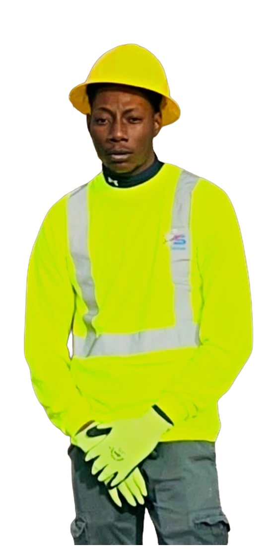 Kenny working in the field in hi-vis and a hard hat